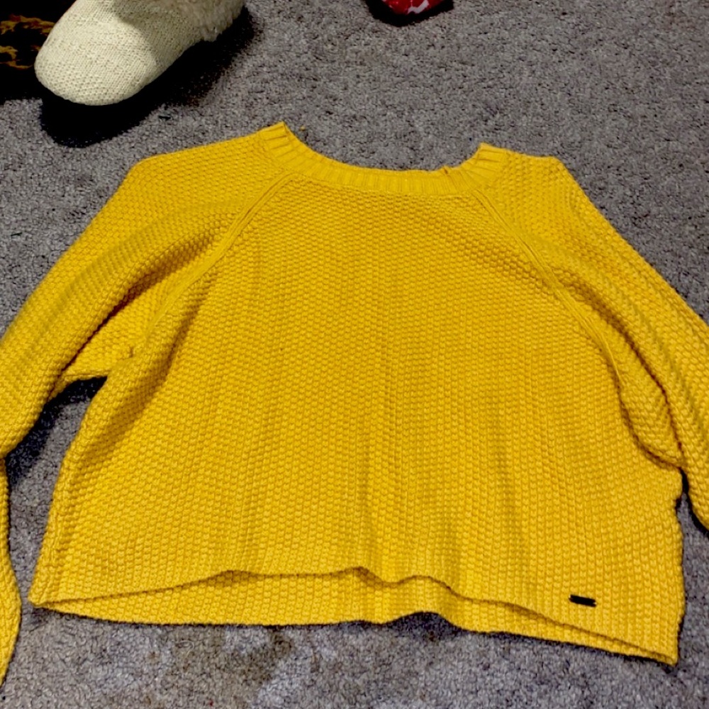 This is a yellow sweater from Hollister, size small, worn twice